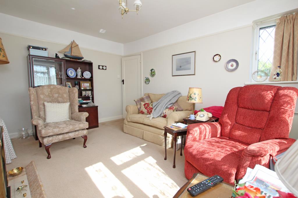 Lot: 129 - DETACHED BUNGALOW LET ON REGULATED TENANCY - Rear of living room taken August 2024
